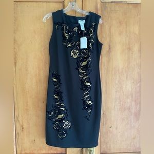 Black sleeveless dress with gold and flocked black scroll design